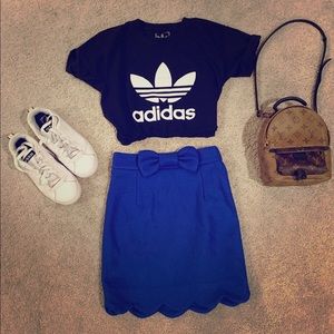 Blue mini skirt with cute bow. Never worn